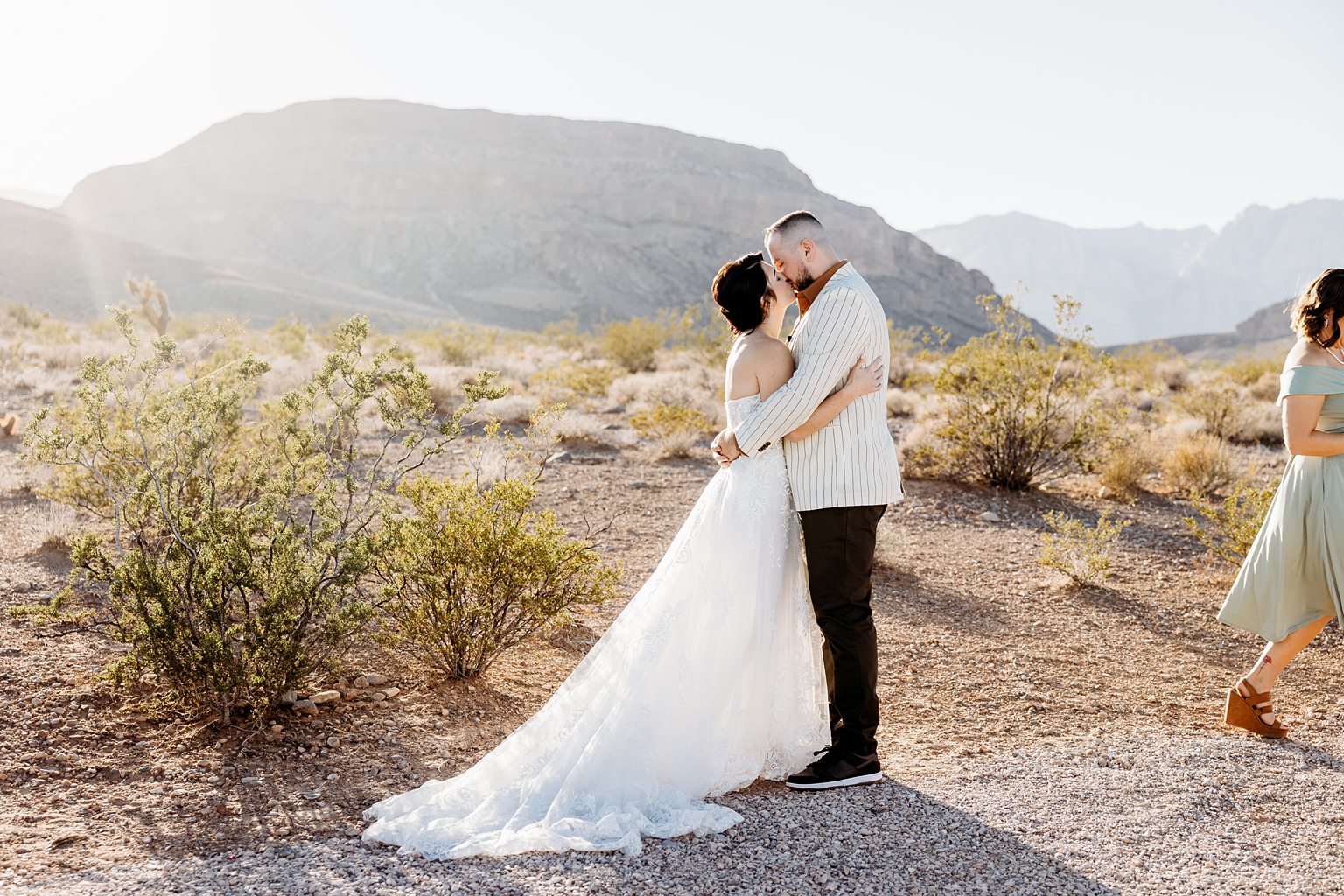 Bride and groom kissing after their Cactus Joe's wedding ceremony on Desert Love Land