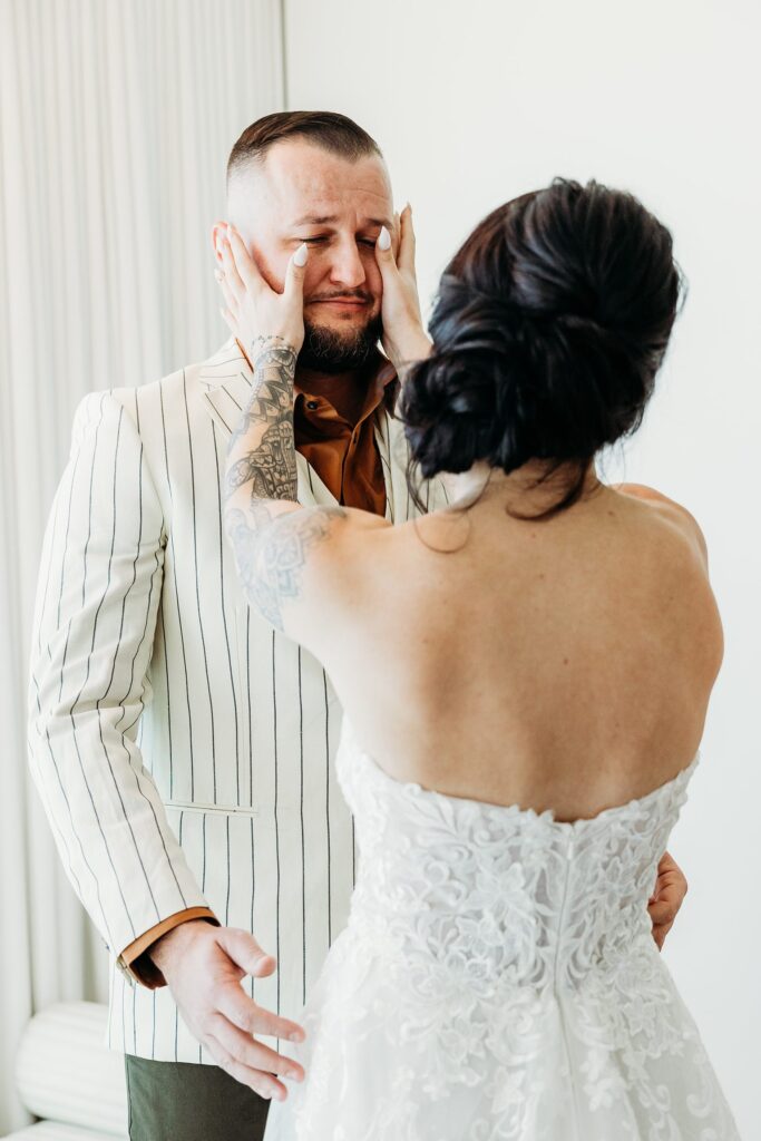 Groom getting emotional after seeing his bride during their first look