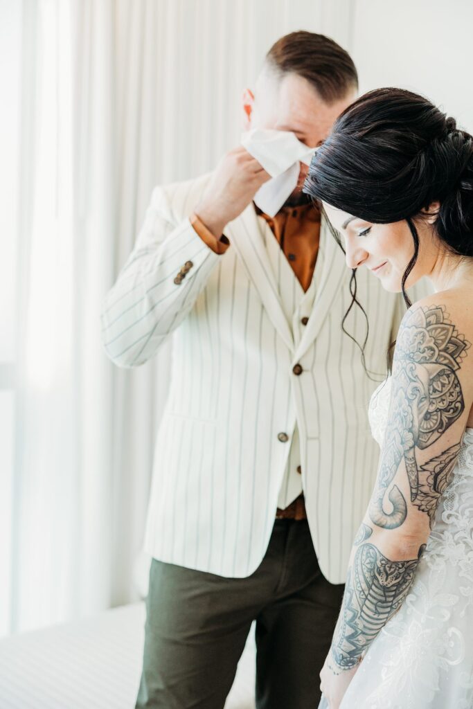 Groom getting emotional after seeing his bride during their first look