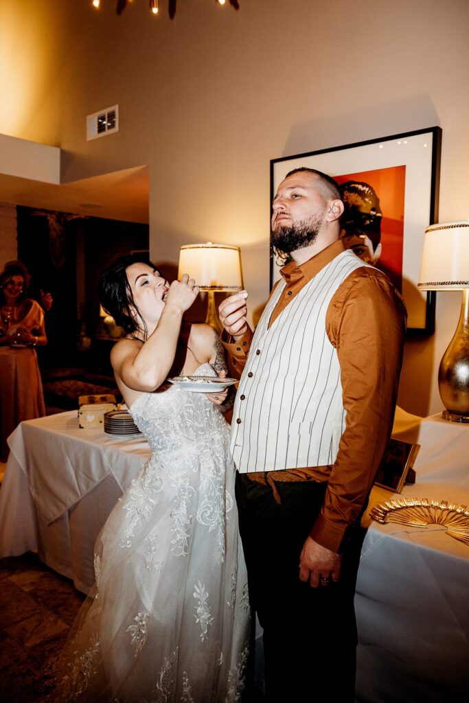 Bride and groom eating their cake