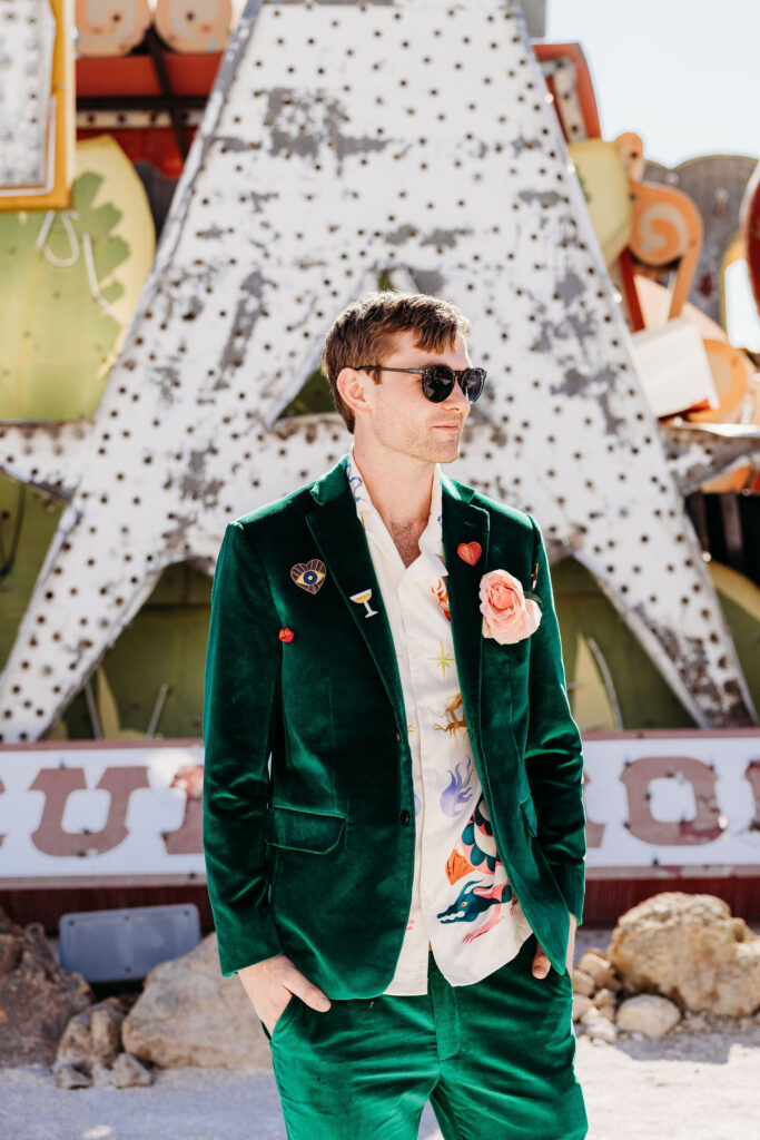 picture of the groom at the neon museum  