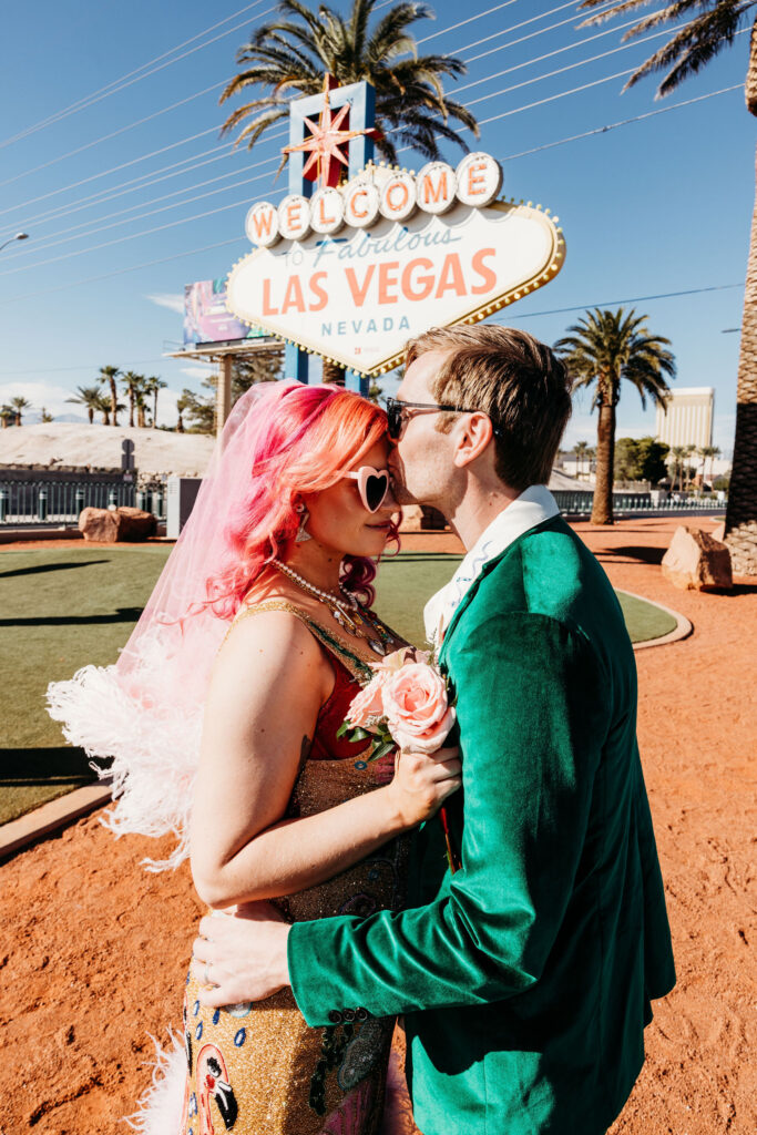 groom kissing the bride in the forehead