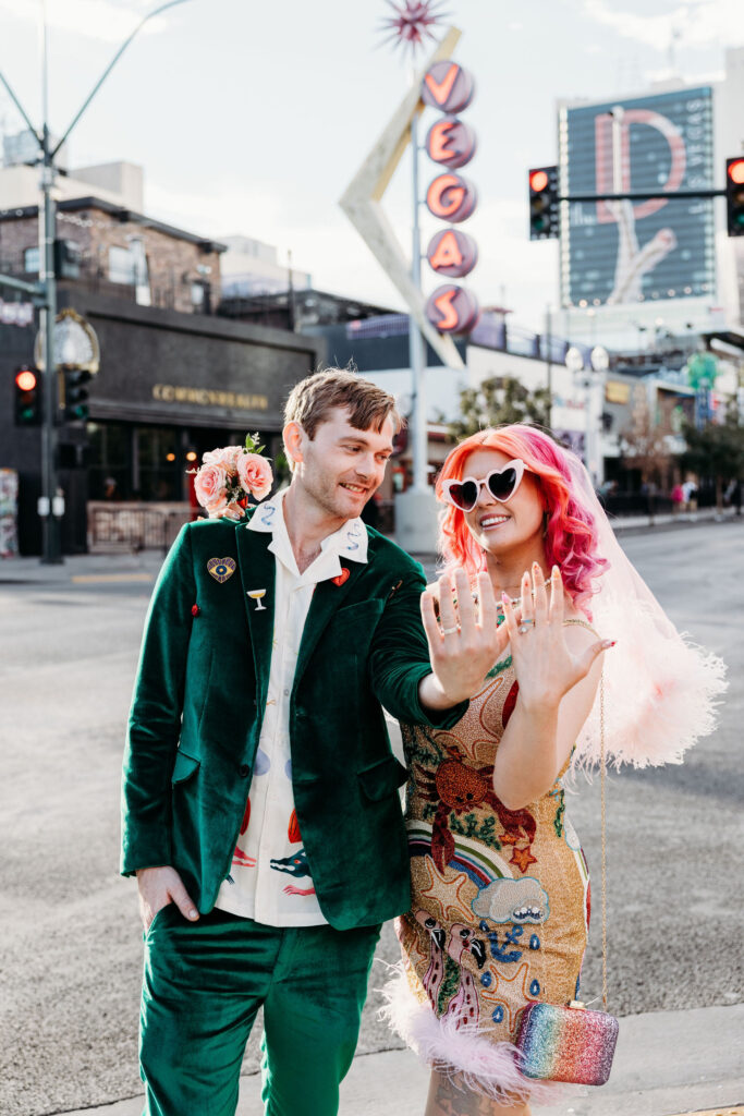 newly married couple showing their wedding rings