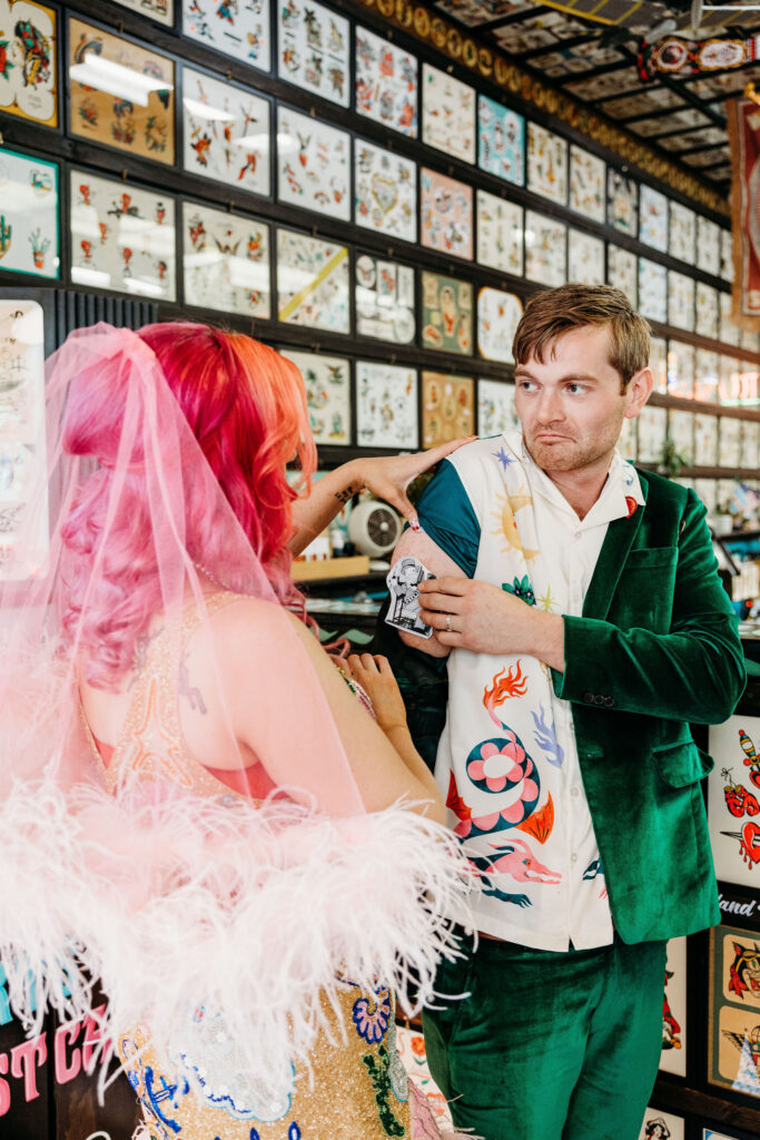 newlyweds at a tattoo shop