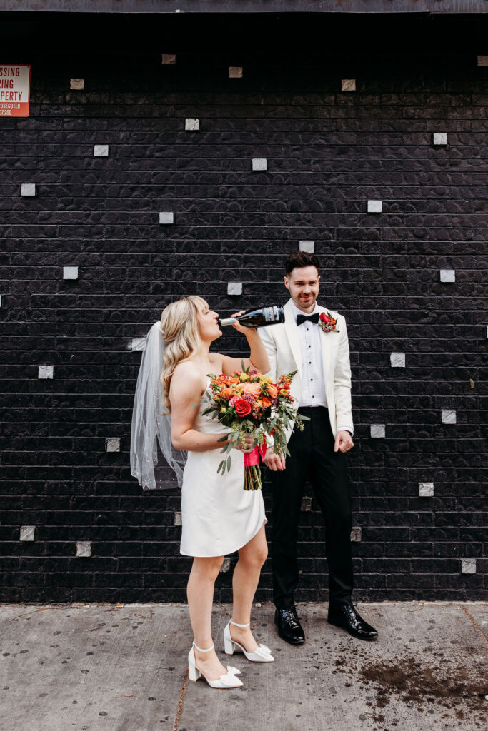 bride drinking champagne after her elopement ceremony