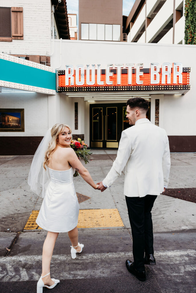 couple walking around DTLV after their elopement ceremony