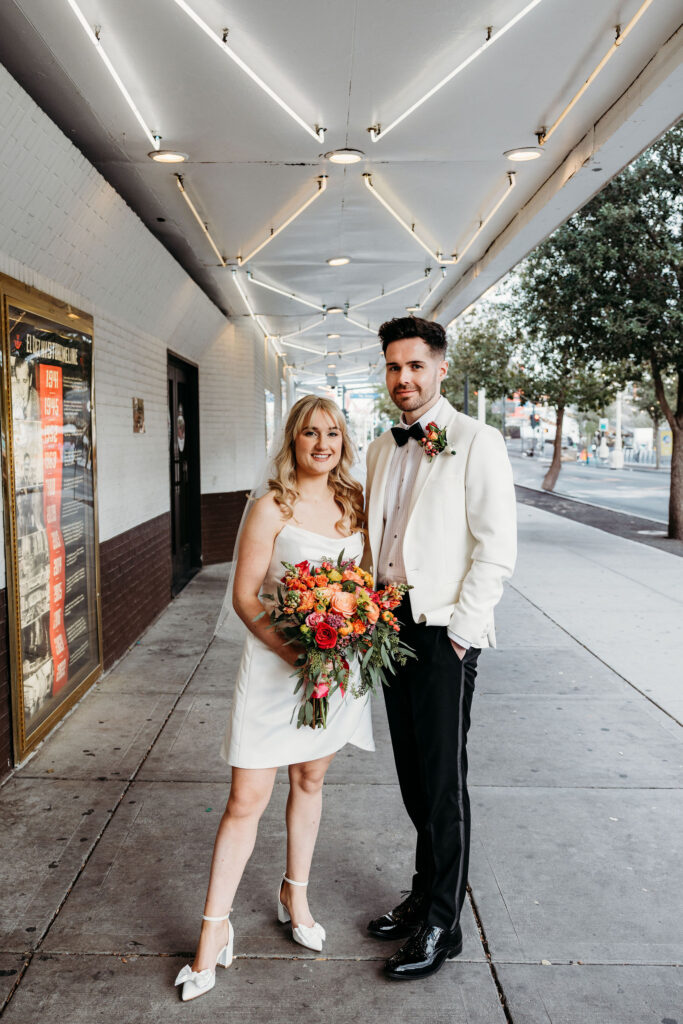 cute newly married couple posing for the camera during their bridal session