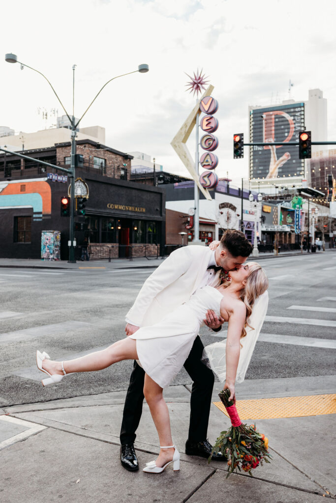 newlyweds kissing during their photoshoot