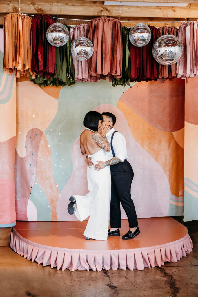 bride and groom kissing after their ceremony