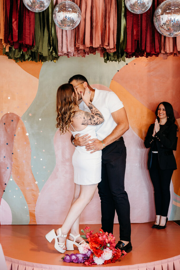 newlyweds kissing after their ceremony