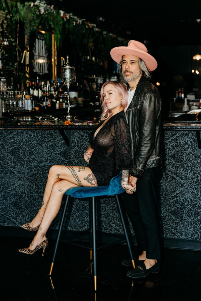 couple celebrating their elopement with a drink