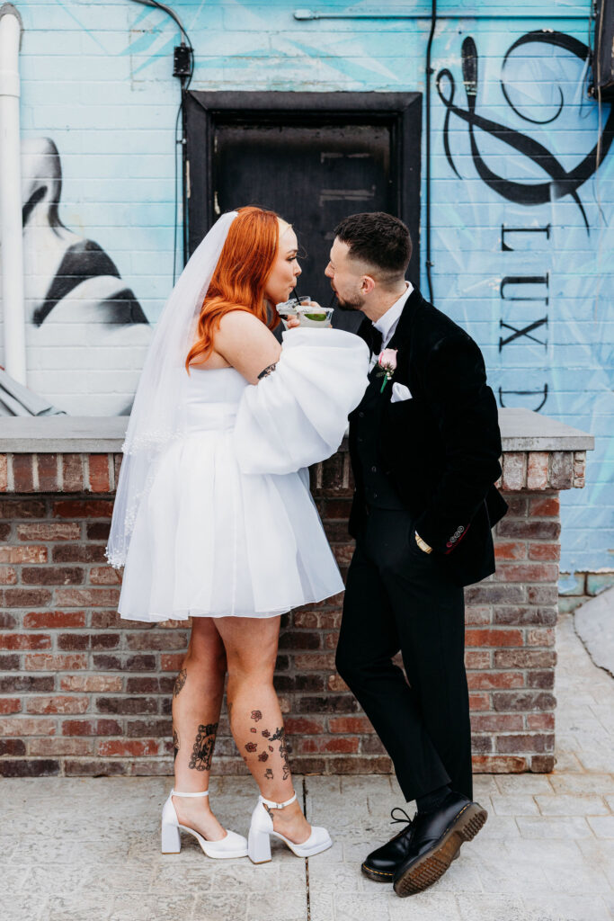couple celebrating their elopement with some drinks
