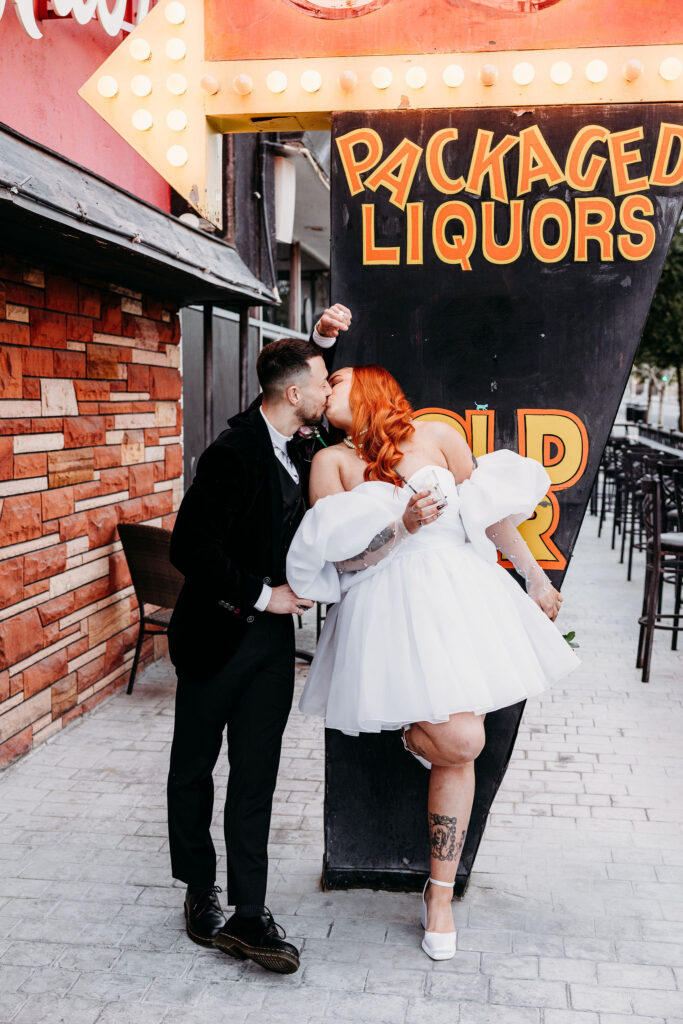 newlyweds kissing during their bridal photoshoot