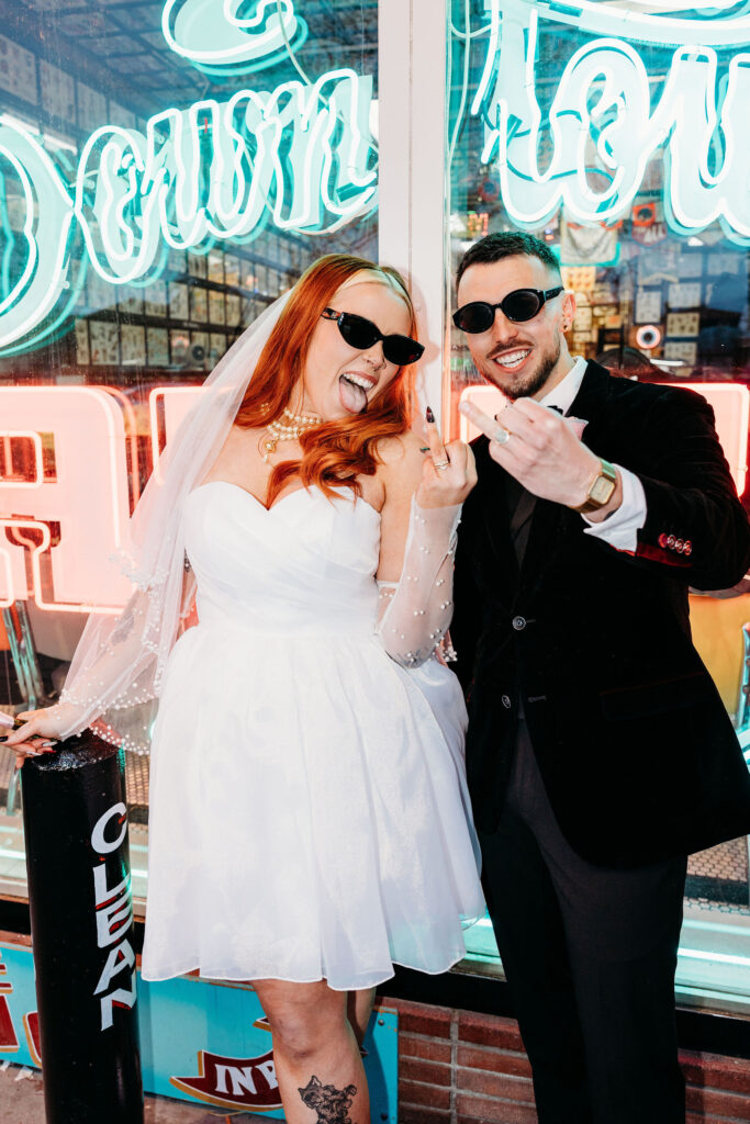 fun picture of the newlyweds showing their wedding rings