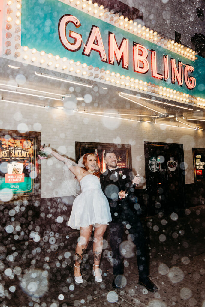 couple celebrating their elopement with champagne