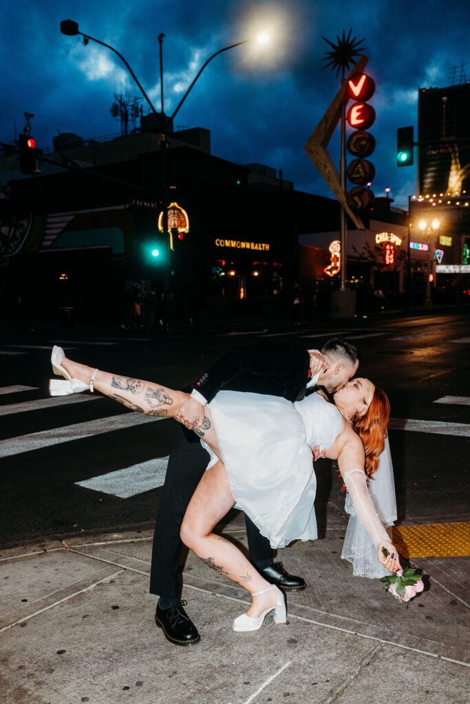 cute picture of the newlyweds kissing during their photoshoot