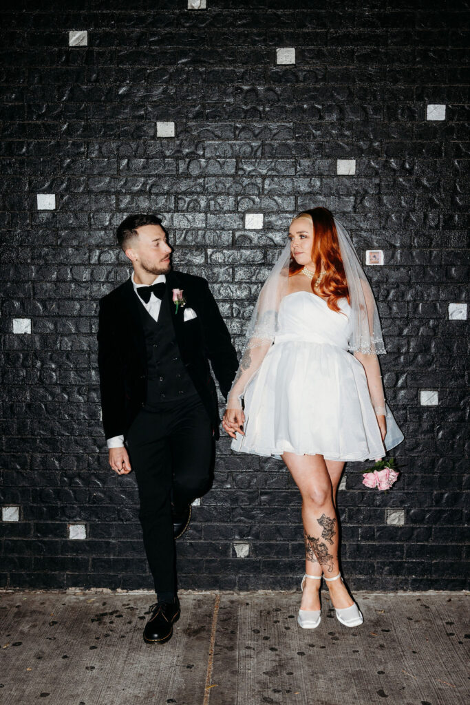 couple holding hands looking at each other
