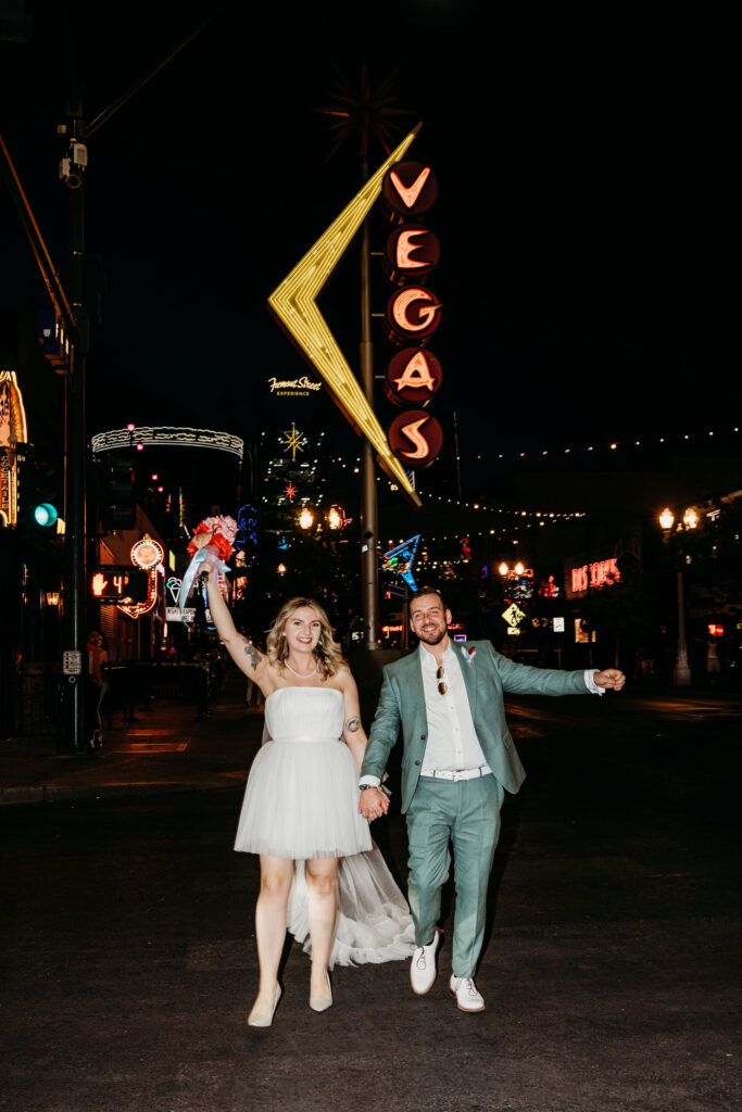 couple having the best time in vegas after their elopement ceremony