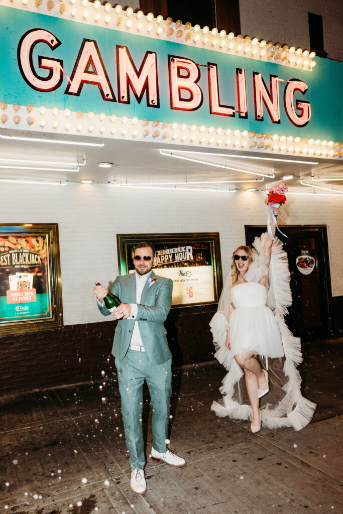 couple celebrating their elopement with champagne