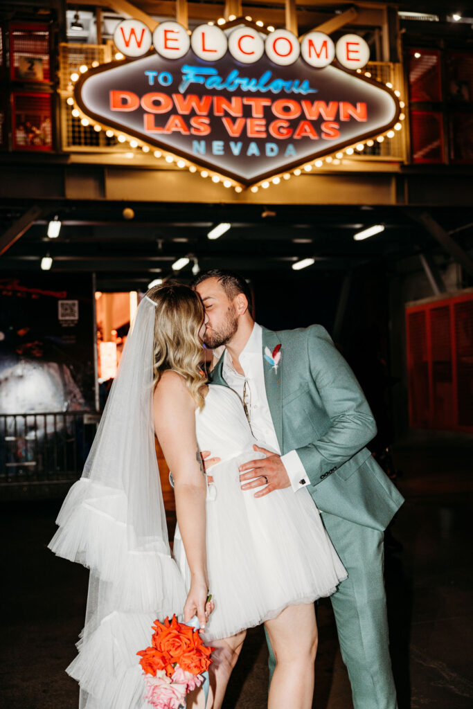 portraits of the newlyweds kissing
