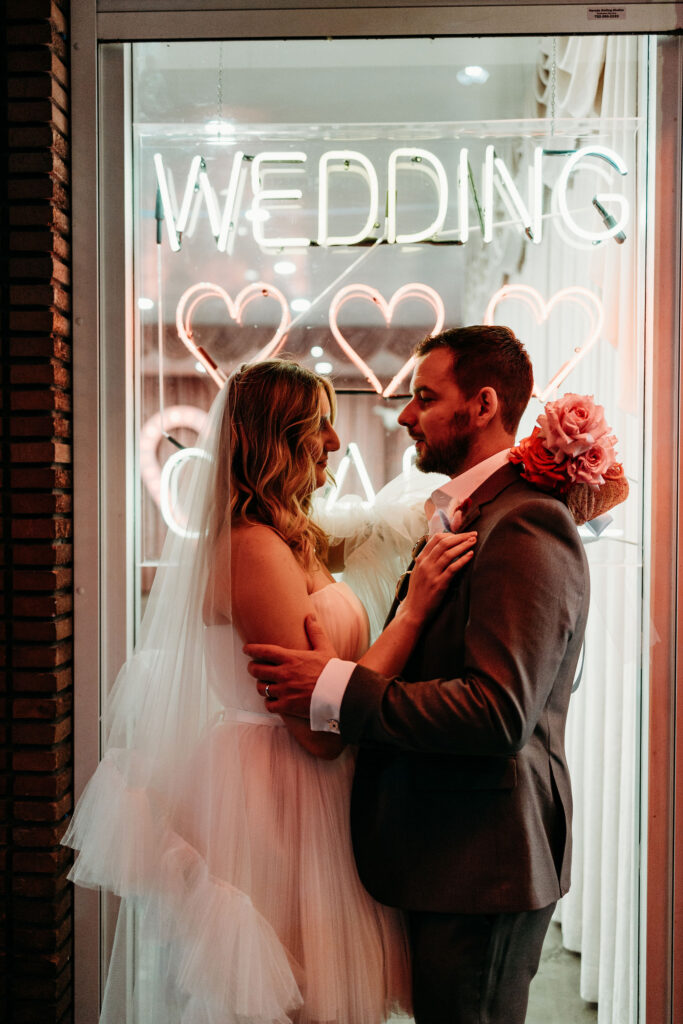 couple smiling at each other during their photoshoot