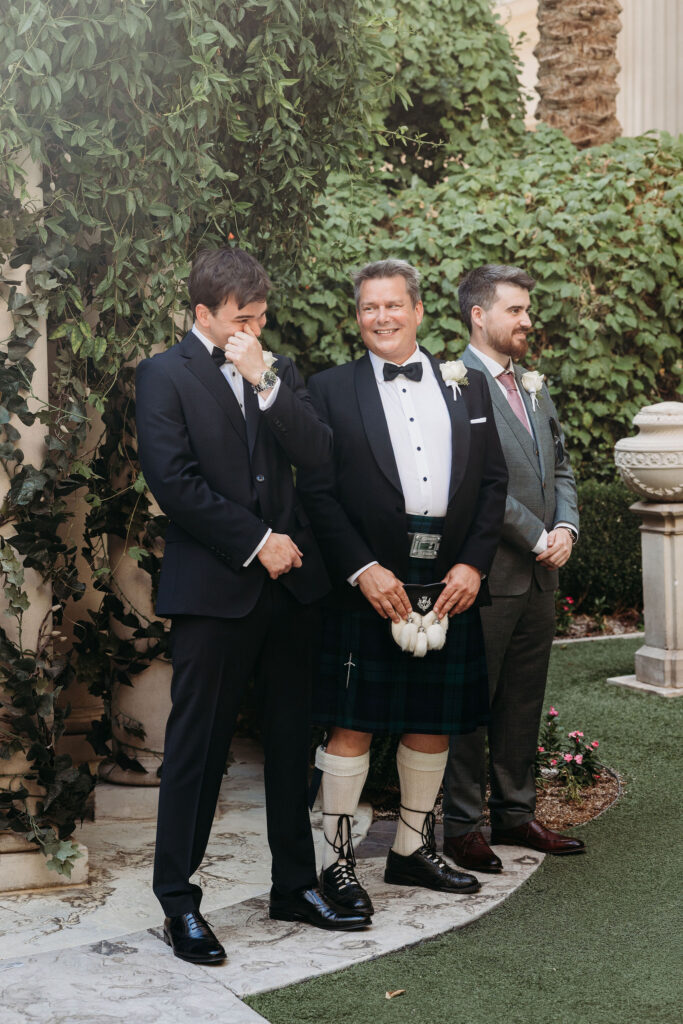 Groom emotional, watching the bride walk down the aisle
