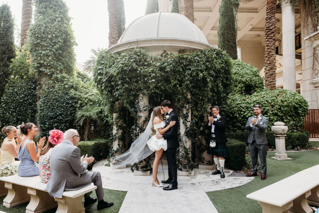 Bride and groom, kissing after their ceremony