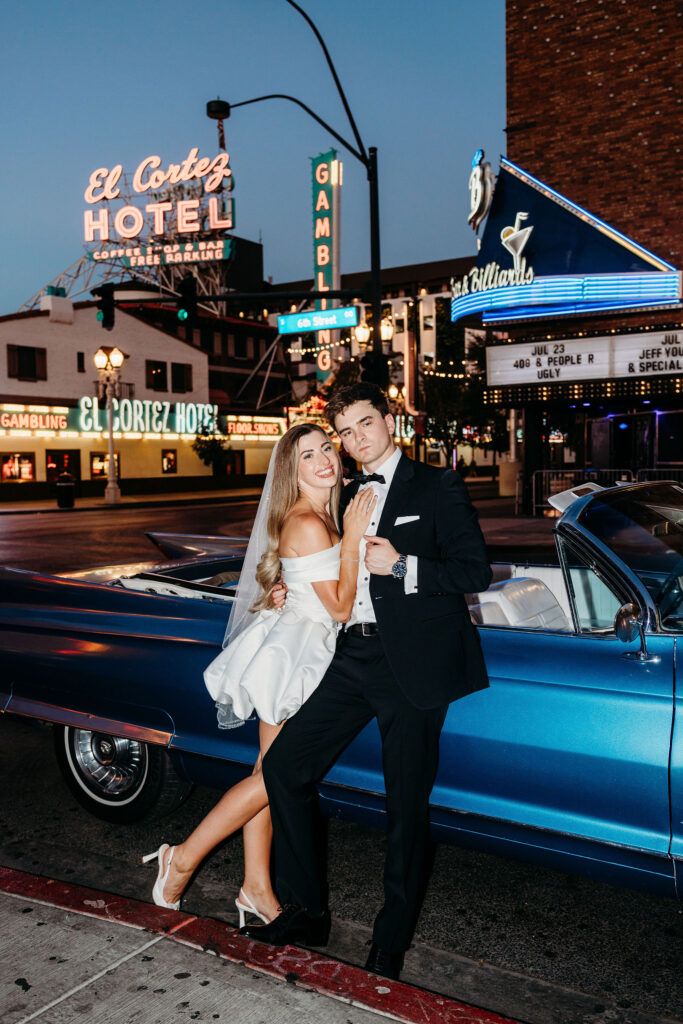 Couple smiling at the camera during their fun bridal portraits