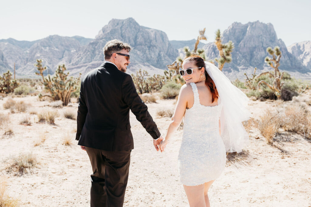 Picture of the bride and groom holding hands