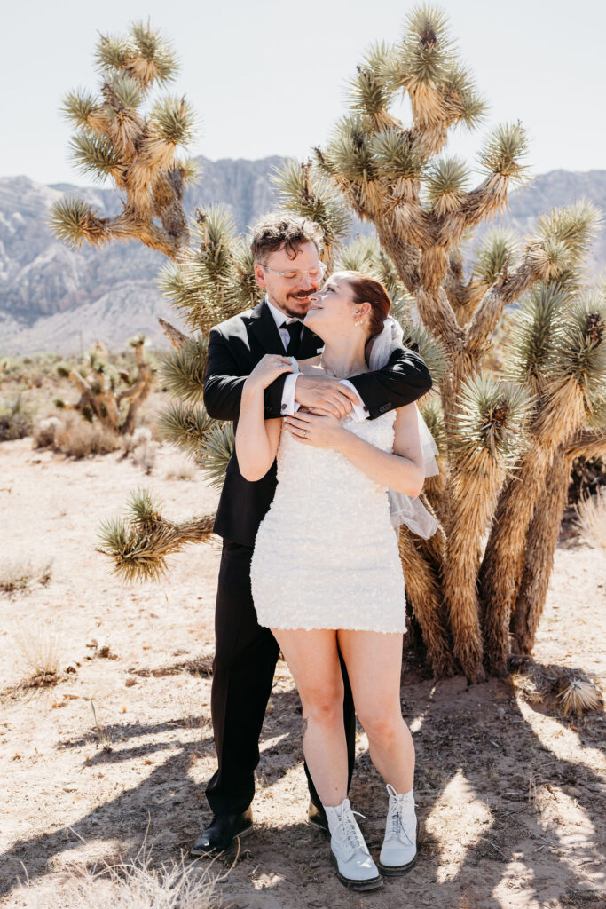 Picture of the bride and groom, smiling at each other