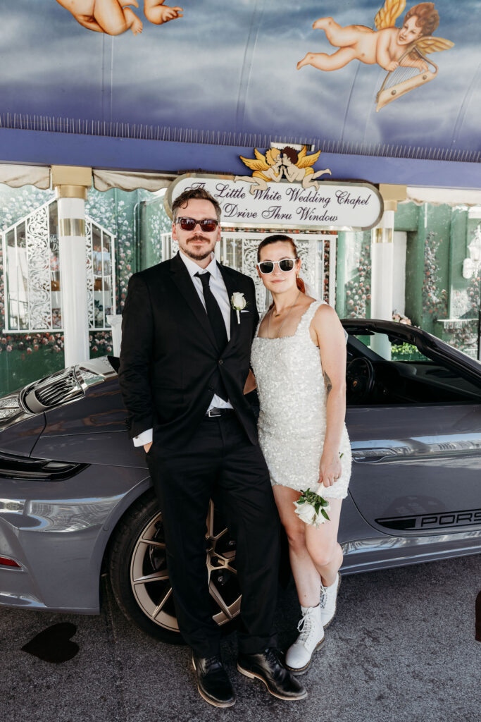 Picture of the newly married couple smiling at the camera