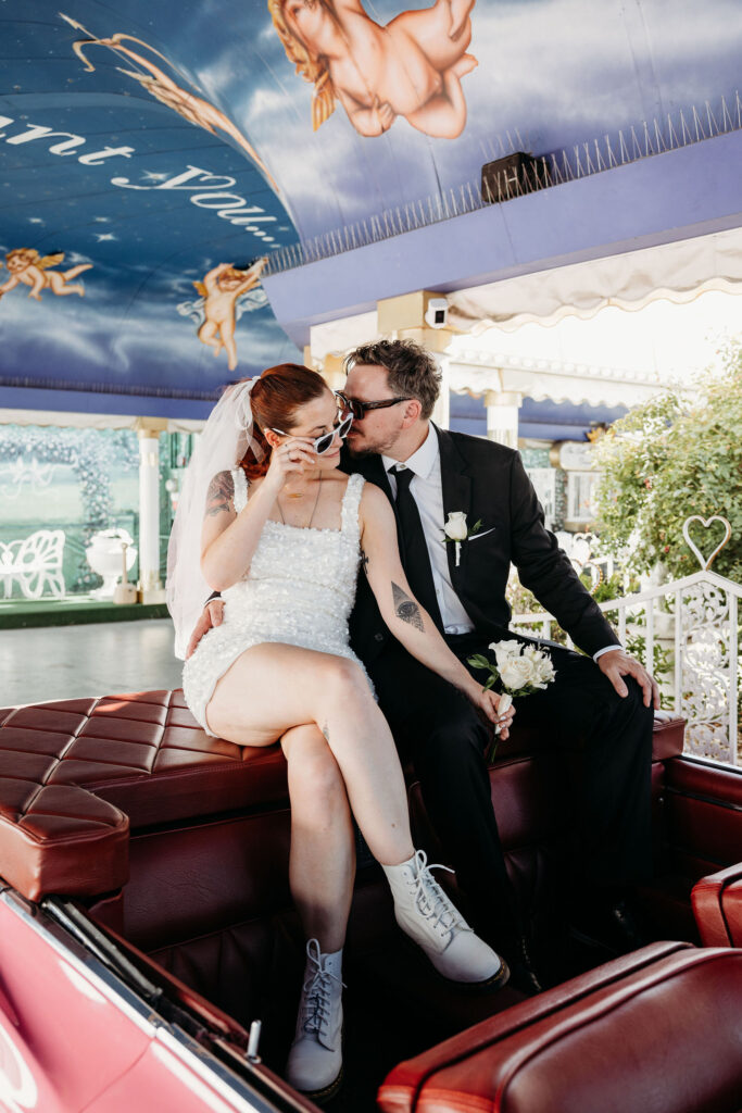 Groom, kissing the bride on the cheek