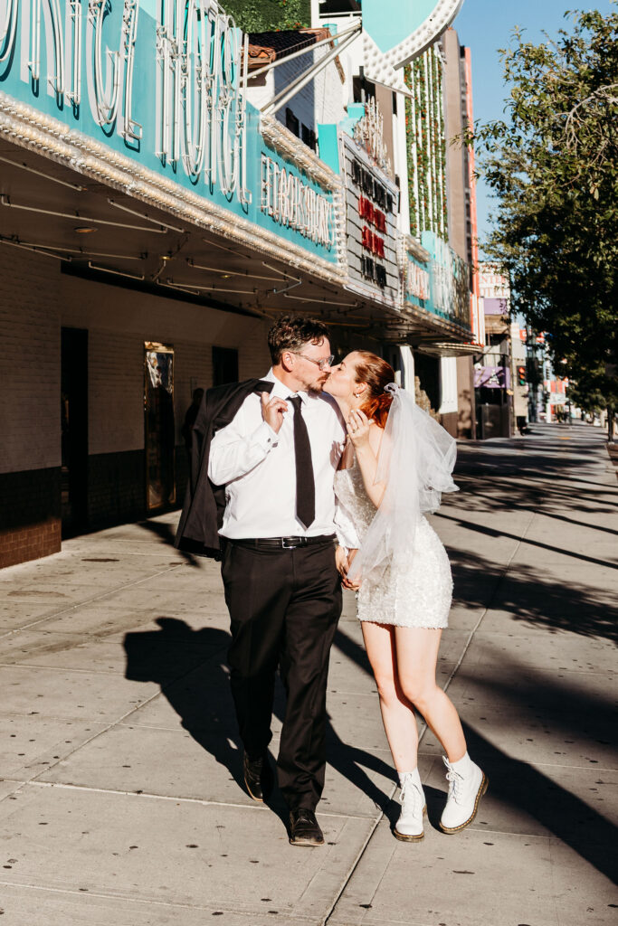 Happy couple other playful elopement