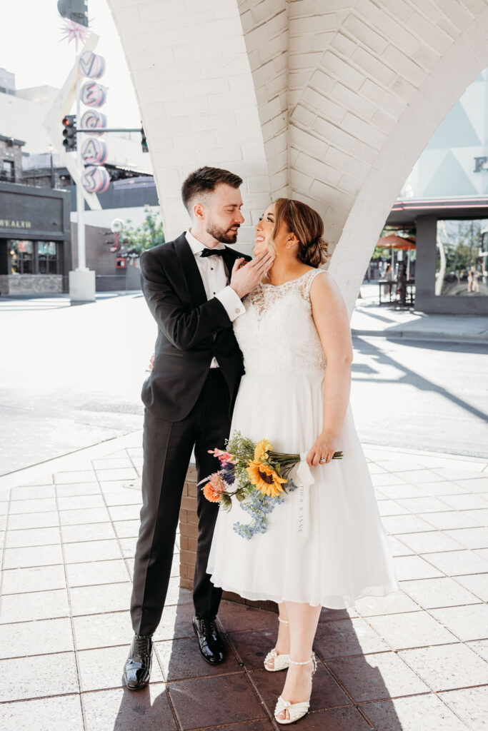 portrait of the newlyweds smiling at each other