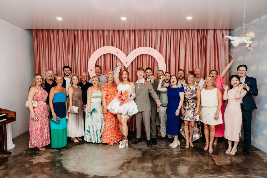 picture of the bride and groom with their guests