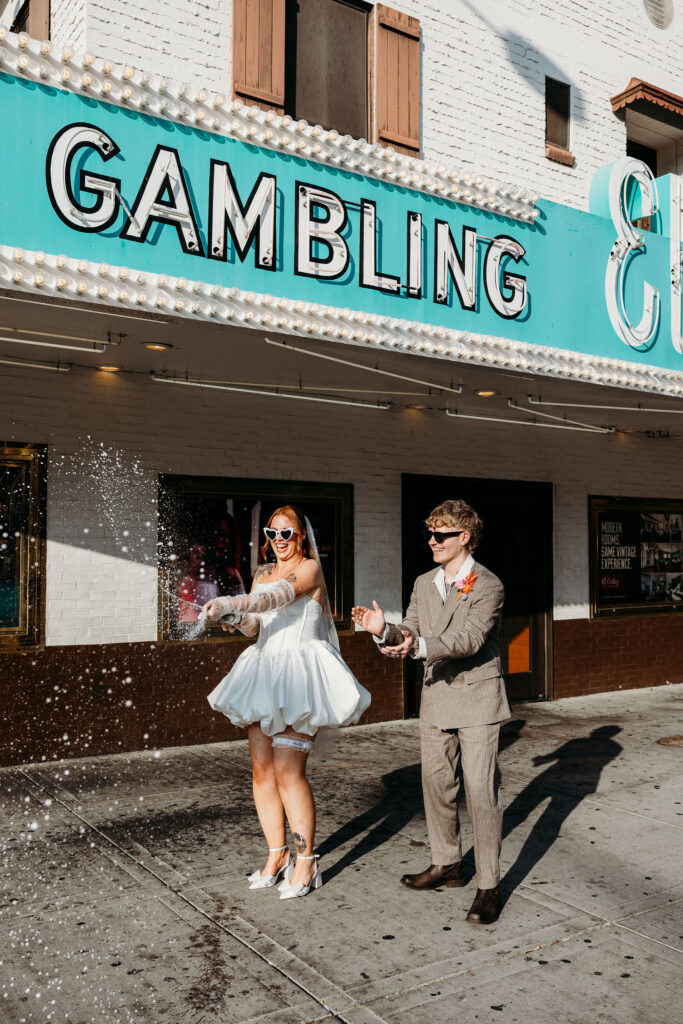 Newly married couple celebrating with champagne