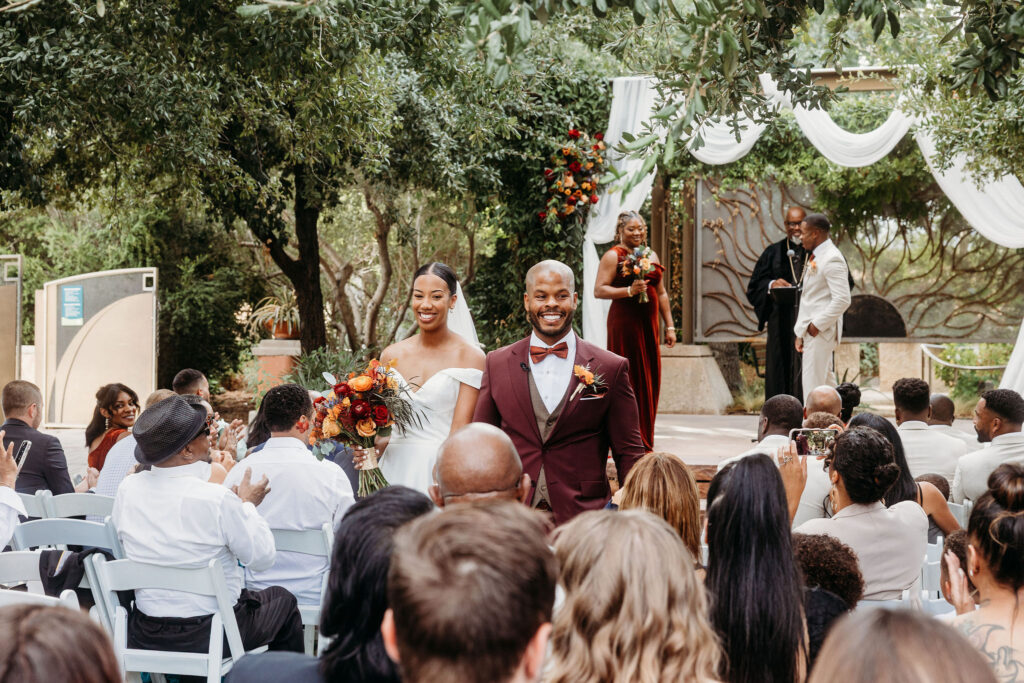 newlyweds heading to the wedding reception