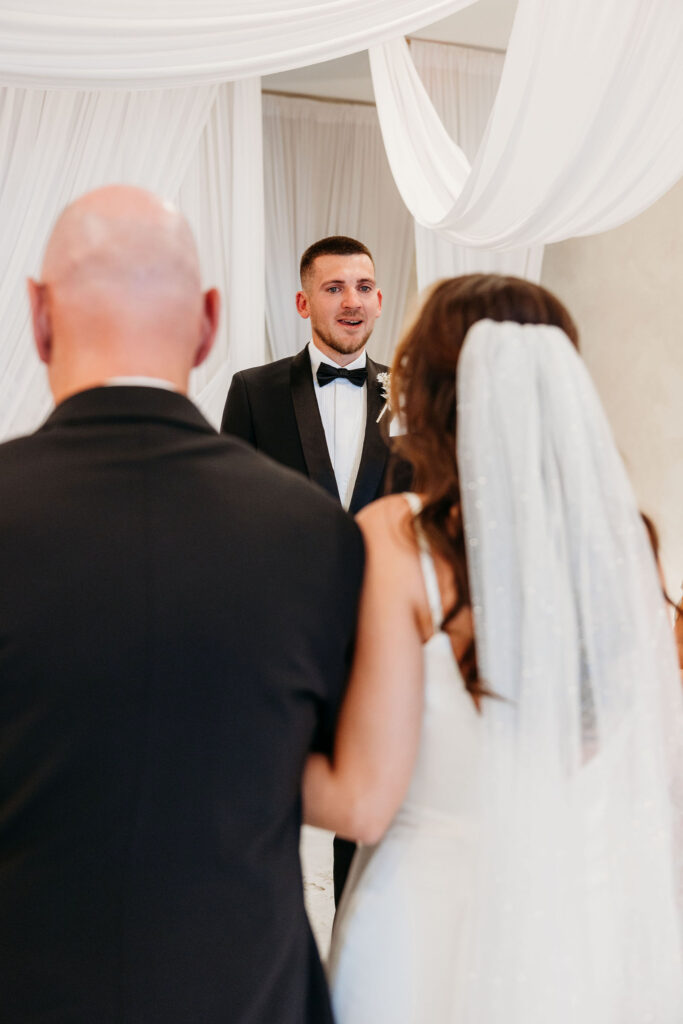 cute picture of the bride walking down the aisle 