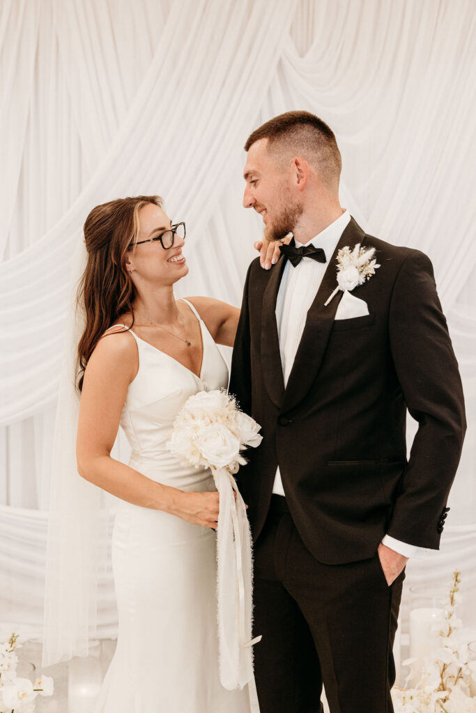 couple laughing with each other during their bridal photos
