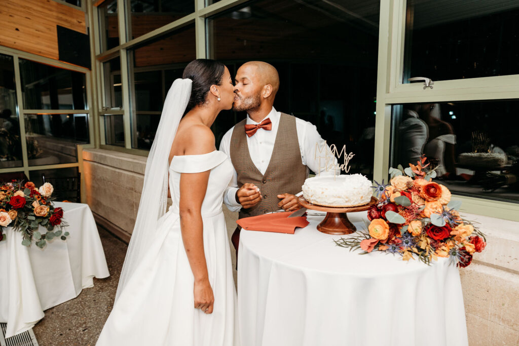 picture of the newlyweds kissing at their wedding reception