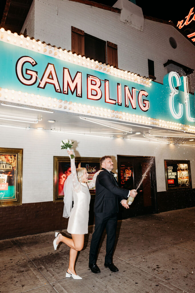 newlyweds celebrating their elopement with champagne
