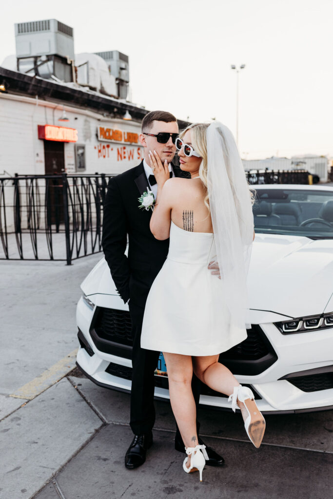 groom kissing the bride on the cheek