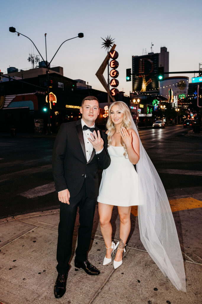 picture of the newlyweds showing their wedding rings