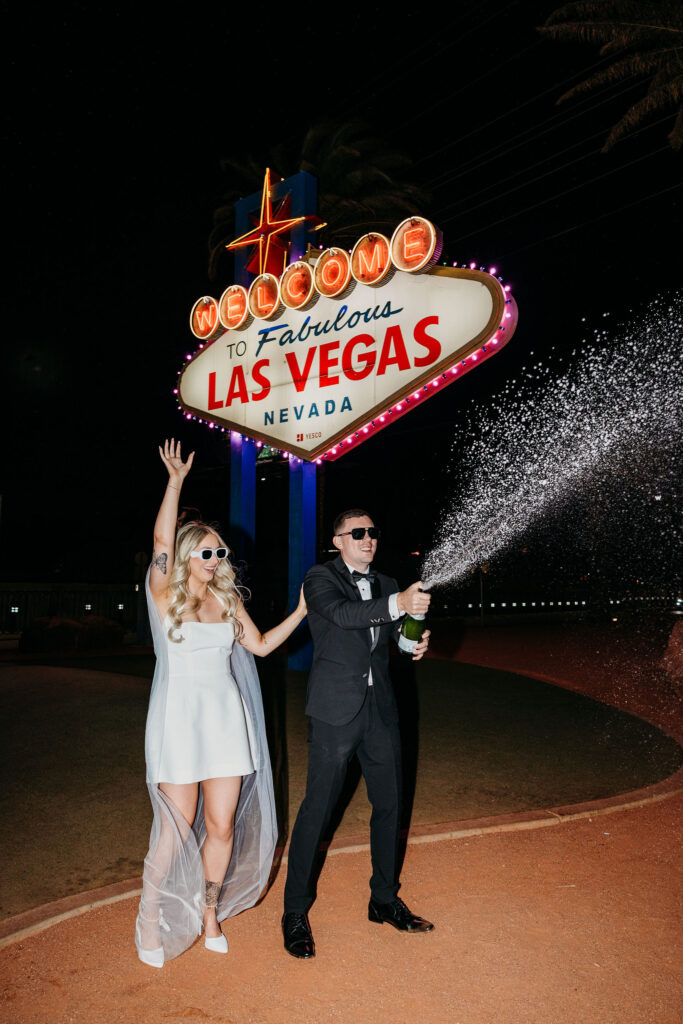couple celebrating their elopement with champagne