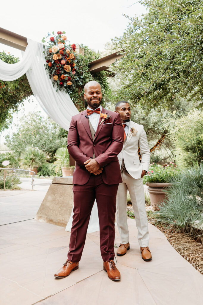 groom emotional watching the bride walk down the aisle