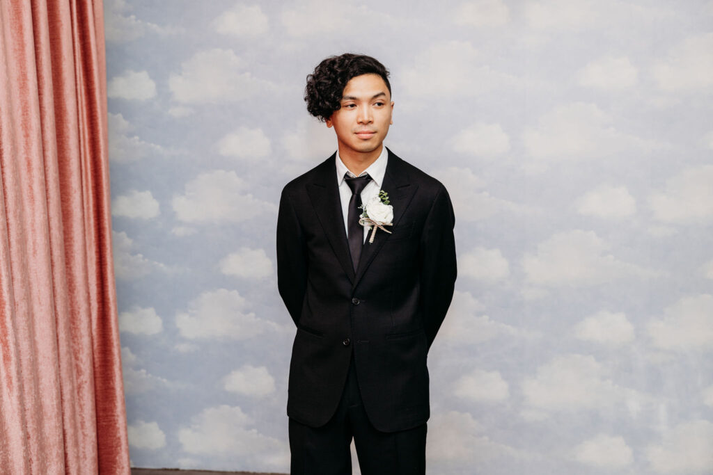 groom watching the bride walk down the aisle