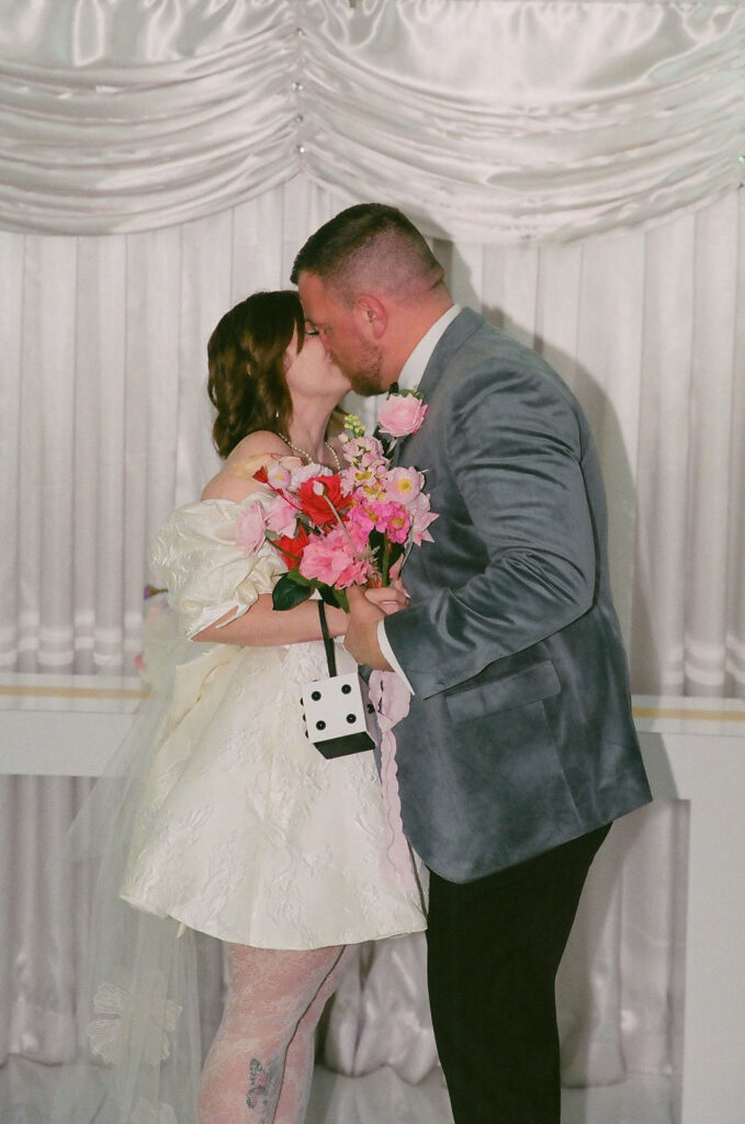 cute picture of the newlyweds kissing