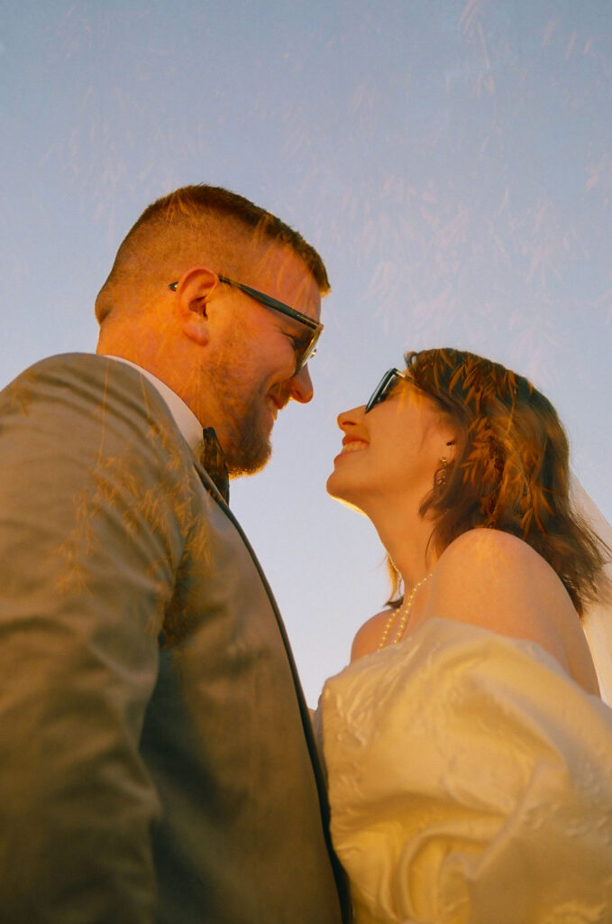 cute picture of the newlyweds smiling at each other