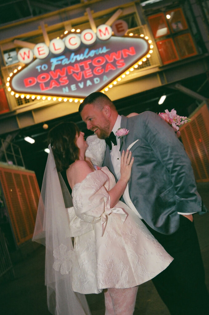 portrait of the newlyweds kissing