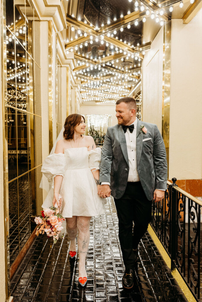 portrait of the newlyweds holding hands